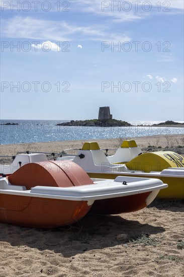 Pedal boats on the beach in front of the Torre di Bari Sardo