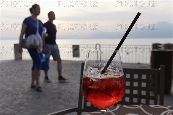 Sundowner Campari Sprizz on a table on the promenade