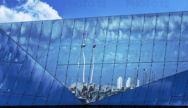 Reflection of the TV tower in the glass façade of the Cube at the main station