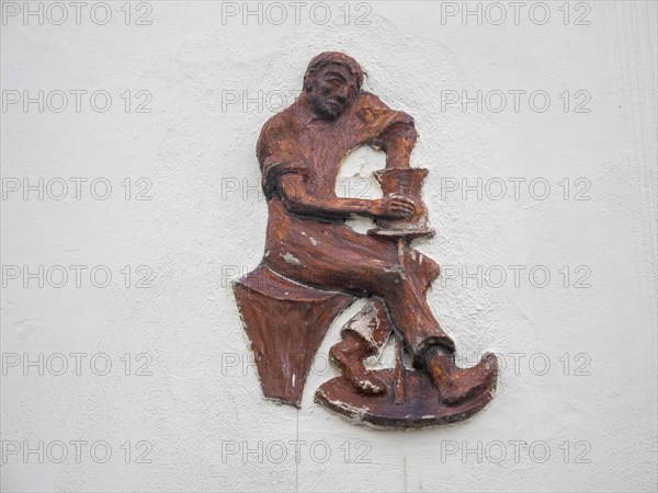 Man sitting at a potter's pane