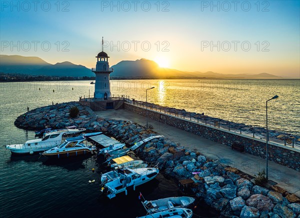 Sunrise over Lighthouse and Marina from a drone