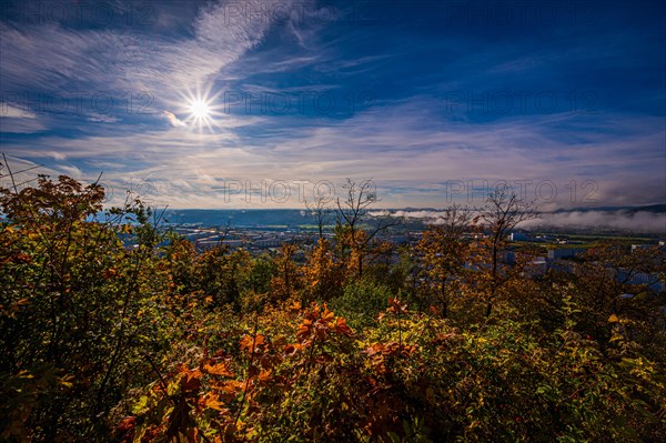 View of Jena Lobeda in autumn early morning with fog and sun star