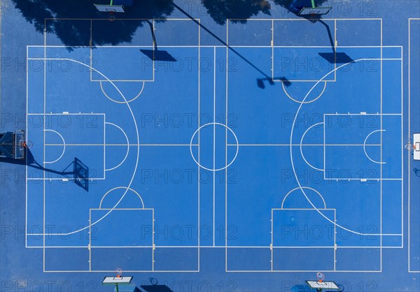 Aerial vision of blue outdoor basketball court