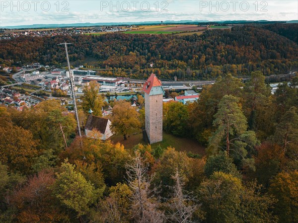 Historic tower in the autumn forest