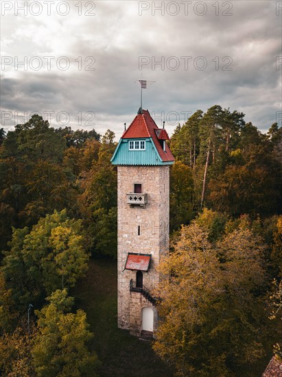 Historic tower in the autumn forest