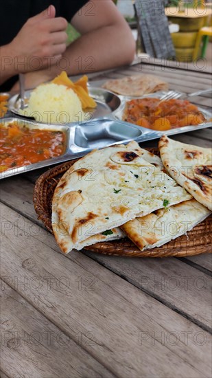 Tourist foodie eating vegetable curry or tarkari