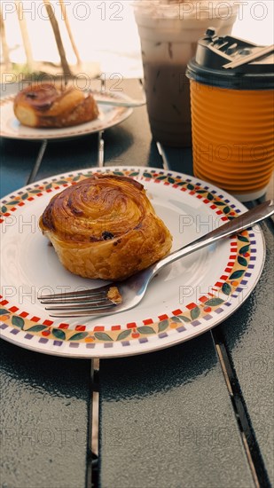 Cinnamon roll with coffee for take away