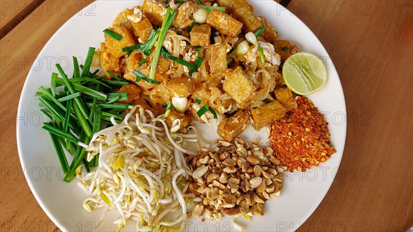 Overhead view of a plate of tofu pad thai