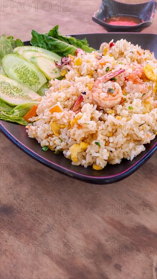 Vertical view of a plate of Khmer fried rice with shrimps or Bai Cha Kapi