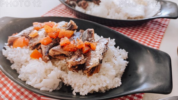 Ginisang sardinas or sauteed sardines with tomatoes paired with rice