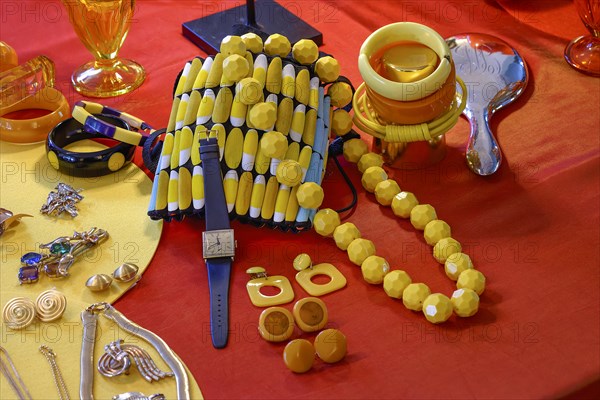 Various pieces of jewellery decorated on a table