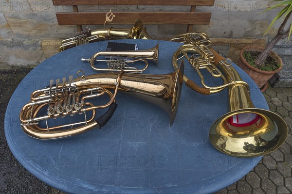 Discarded musical instruments of the brass band on a table