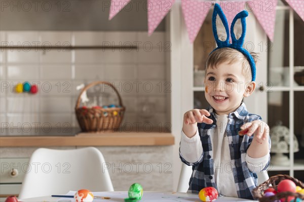 Adorable little kid with bunny ears posing