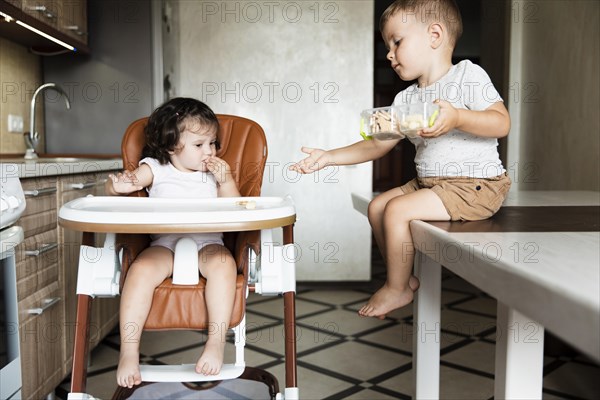 Adorable young siblings kitchen