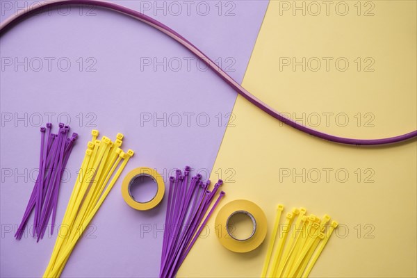 Arrangement insulating tape nylon zip wire purple yellow dual backdrop