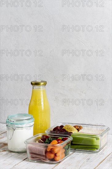 Arrangement with packed food juice bottle