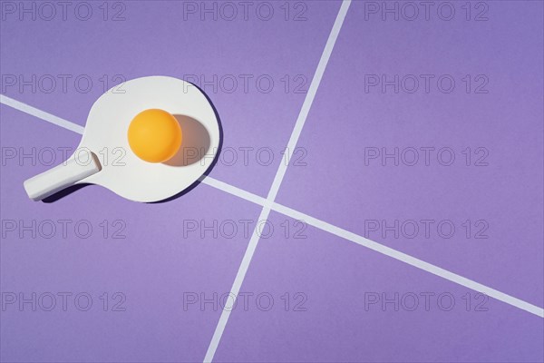 Badminton paddle purple background