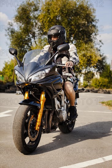 Biker motorbike waiting cross road