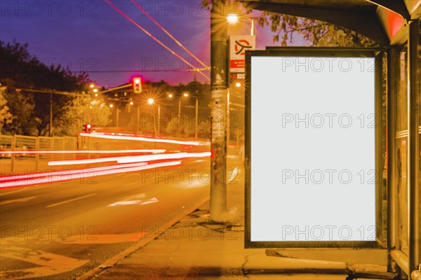 Blank billboard bus stop night