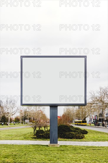 Blank vertical street billboard poster green grass city road