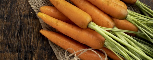 Bunch fresh carrots wooden table