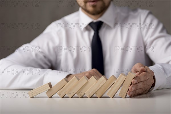 Businessman with tie dominoes