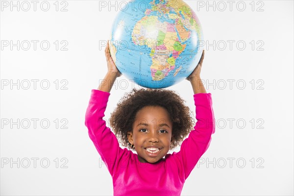 Child holding globe head studio