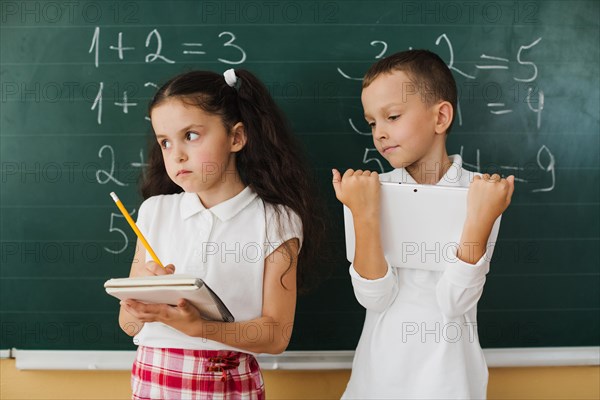 Classmates blackboard math lesson