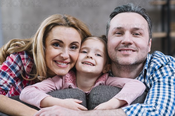 Close up happy family looking camera
