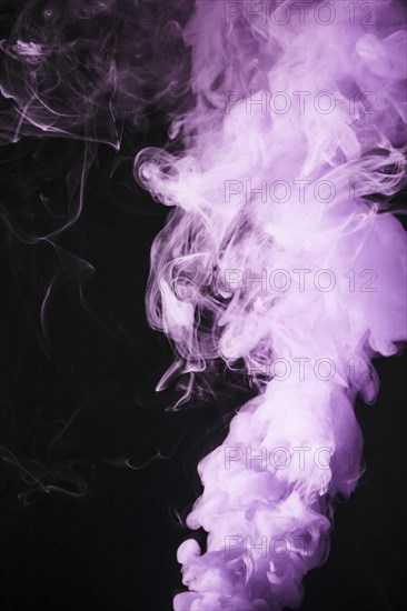 Close up pink smoke overlay texture black background