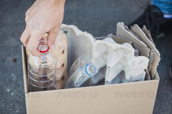 Close up plastic bottles egg carton box