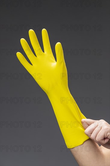 Close up woman hand with glove close up