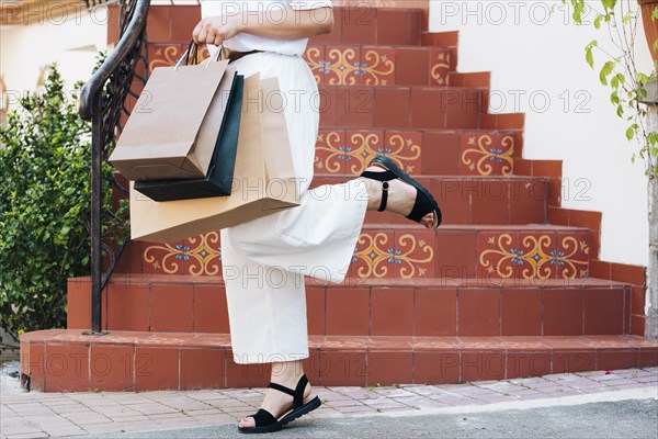 Close up woman holding her leg up