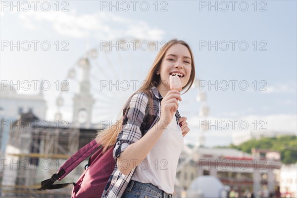 Close up woman holding popsicle icecream smiling