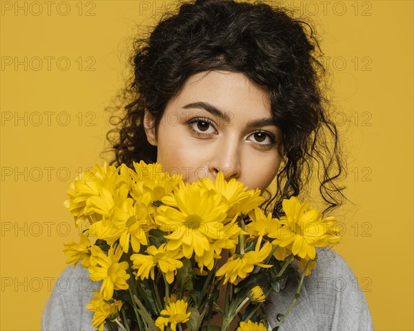 Close up woman posing with flowers