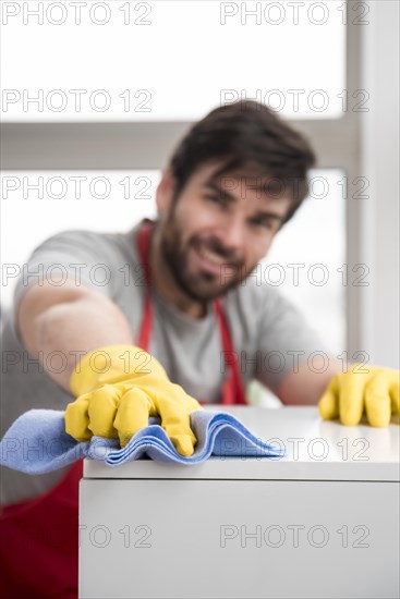 Concept man cleaning his home