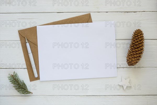 Copy space card with envelope christmas pine needles cone