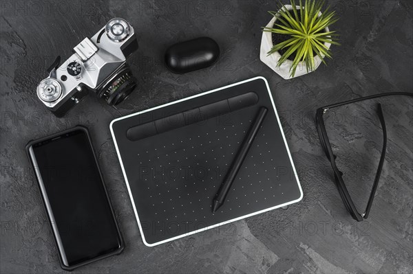 Desk arrangement slate background top view