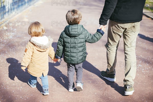 Father walk with sons