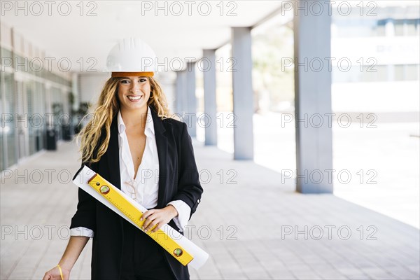 Female architect with helmet level