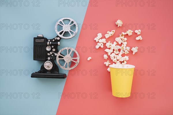 Film projector with popcorn box