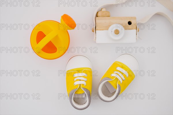 Flat lay baby shoes with white background
