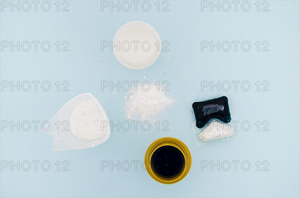 Flat lay detergent powder capsule colorful background