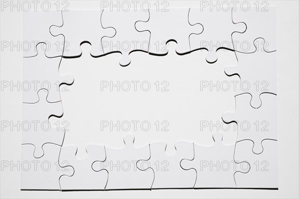 Frame made from white puzzle piece white background