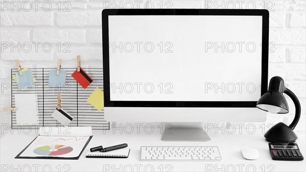 Front view office desk with computer lamp