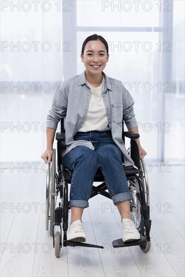 Full shot happy woman wheelchair
