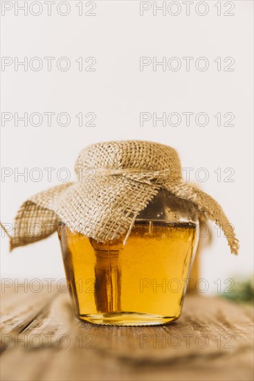 Glass jar sweet honey wooden table