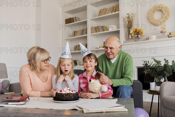 Grandparents granddaughters indoors