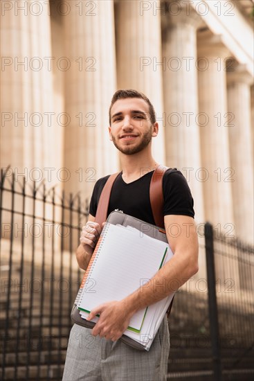 Guy standing university low angle view