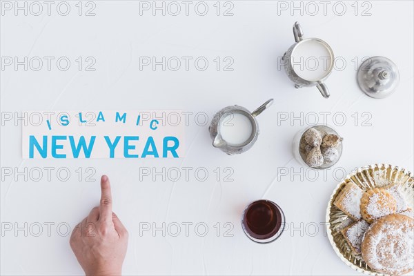 Hand with sweets islamic new year